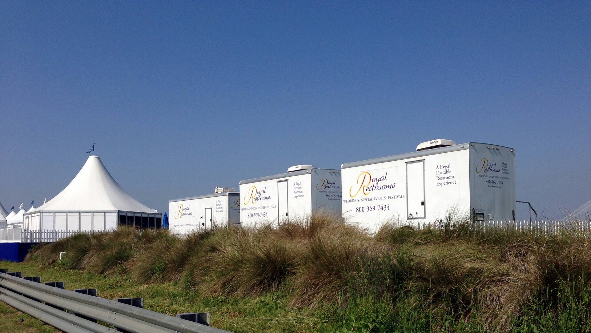 Fleet of Royal Restrooms portable bathrooms at an event.