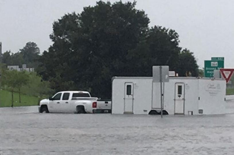 Team Texas responding with a ten-stall restroom trailer during flooding from Hurricane Harveyoutside Houston. Driving though more than three-foot-deep water determined to get to theevacuation basecamp for Houston Citizens